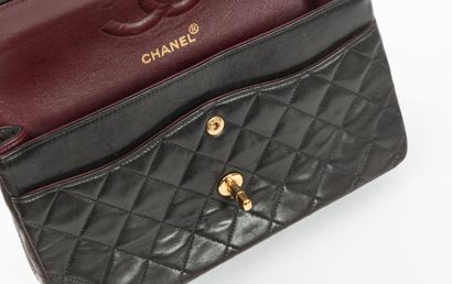 CHANEL
Classic bag with double flap in black...