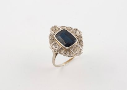 Large white gold (750) ring centered on a...