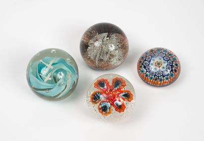 Set of four glass paperweight balls with...