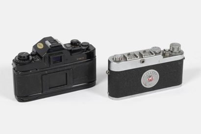 Two cameras, without lenses:
- Leitz Leica...
