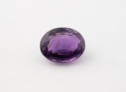 Faceted oval-cut amethyst on paper. 
approx....