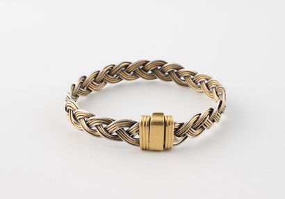 Bracelet en or jaune (750) et argent (800)...