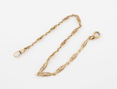 Gold-plated watch chain with filigree shuttle...