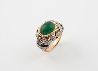 Bague en or jaune et gris (750), la monture...