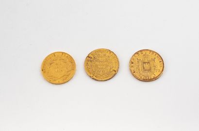 Lot de trois pièces de 20 francs or. Napoléon...