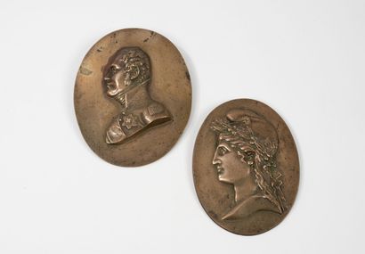 Two oval medallions in low relief in patinated...