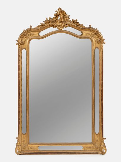 Gilded molded wood and molded plaster mirror...