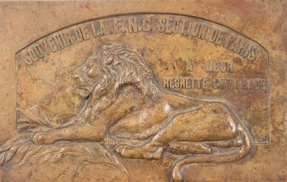 Lot including: 
- A patinated bronze plaque...