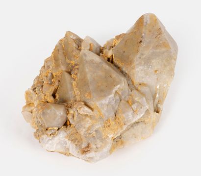 Group of white quartz crystals with yellow...