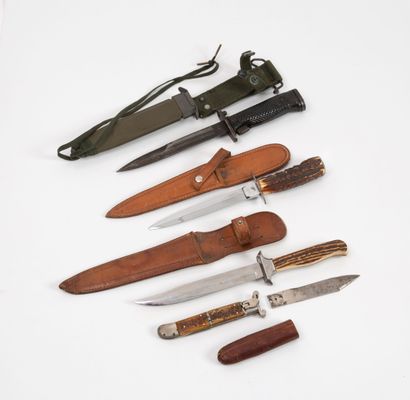 Lot including:
- A reproduction Bowie Knife.
-...