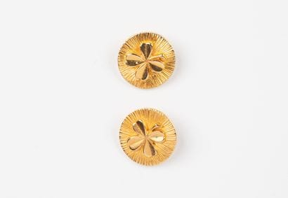 CHANEL, Paris
Two gilded metal buttons, centered...