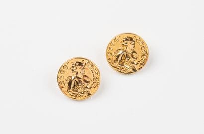 CHANEL, Paris
Two gilded metal buttons centered...