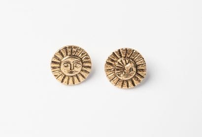 CHANEL, Paris
Two gilded metal buttons, one...
