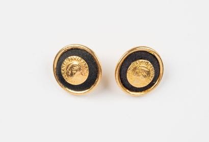 CHANEL, Paris
Two gilded metal buttons, decorated...