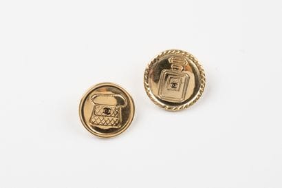 CHANEL, Paris
Two gilded metal buttons, one...