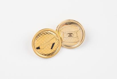 CHANEL, Paris
Two gilded metal buttons, one...