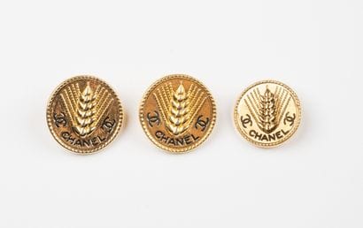 CHANEL, Paris
Three gilded metal buttons,...