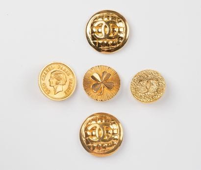 CHANEL, Paris 
Lot of five gilt metal buttons...