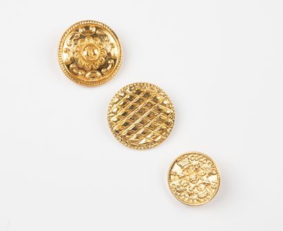 CHANEL, Paris 
Three gilt metal buttons including...