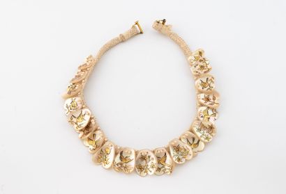 Necklace featuring a cord and heart-shaped...