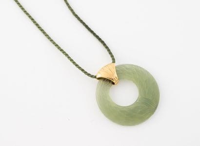 LALIQUE
Green tinted molded glass ring necklace...