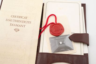 Brilliant-cut diamond on paper under seal.
Weight:...