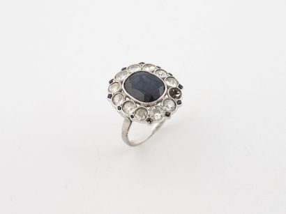 Ring in platinum (850), centered on an oval-cut...