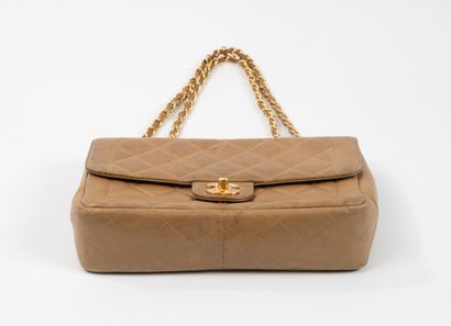 CHANEL 
Flap bag in dark beige quilted lambskin....