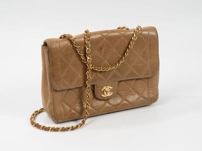 CHANEL 
Flap bag in dark beige quilted lambskin....