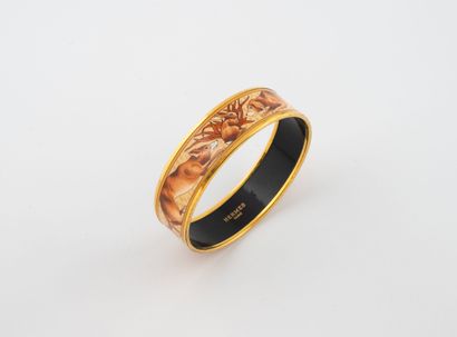 HERMES 
Gilt metal and brown enamel bangle...