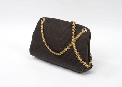 CHANEL
Handbag in chocolate jersey with herringbone...