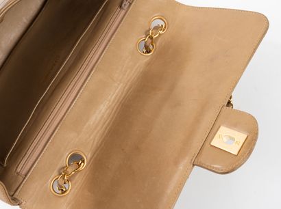 CHANEL 
Flap bag in dark beige quilted lambskin....