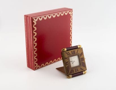 Must by CARTIER 
Travel clock in gilded metal....