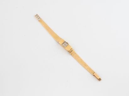 REWEL
Ladies' wristwatch in yellow gold (750).
Rectangular...