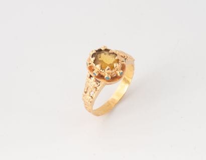 Yellow gold (750) ring, the bezel set with...