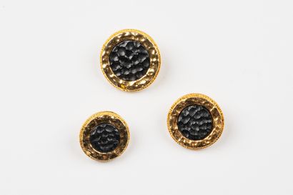 CHANEL, Paris
Three gilded metal buttons...