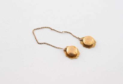 Pair of breastplate buttons in yellow gold...