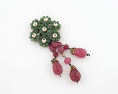 Gilded metal lapel clip featuring a flower...