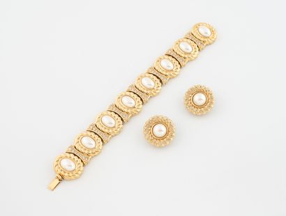 Christian DIOR
Demi-parure en métal doré...