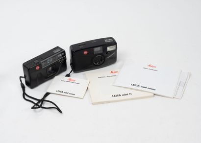 Two Leitz Leica compact cameras.
- Leica...