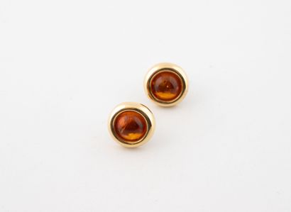 Pair of yellow gold (750) stud earrings centered...