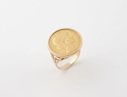 Yellow (750) gold ring set with a 20-franc...