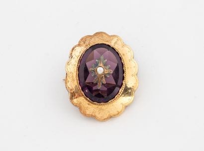 Small oval brooch centered with a white cultured...