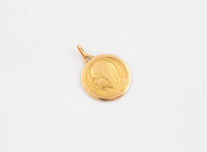 Médaille ronde en or jaune (750) à profil...