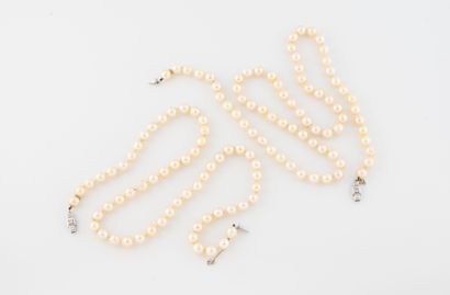 Set of two white cultured pearl necklaces.
White...
