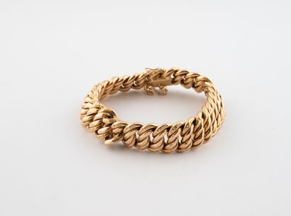 Hollow American link bracelet in yellow gold...