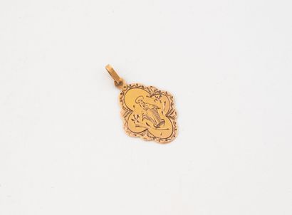 Petite médaille en or rose (750) représentant...