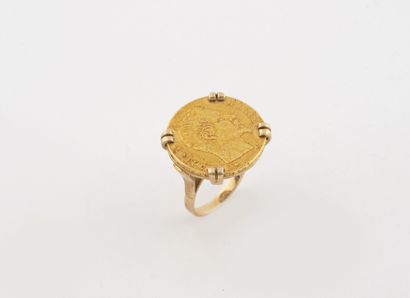 Yellow gold (750) ring centered with a 20-franc...
