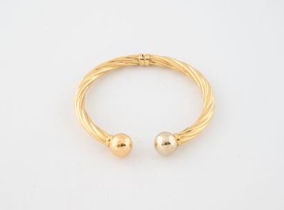 Bracelet jonc ouvrant en or jaune (750) à...