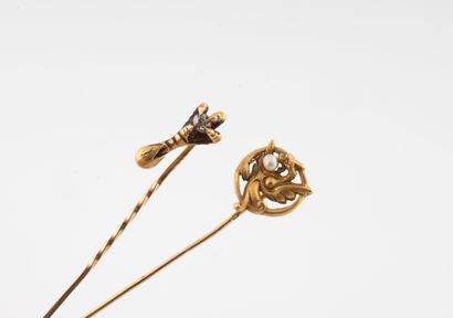 Set of two yellow gold (750) pins, one with...